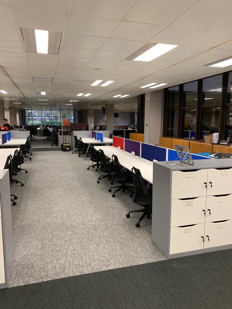 office furniture group desks and chairs installation in a office building